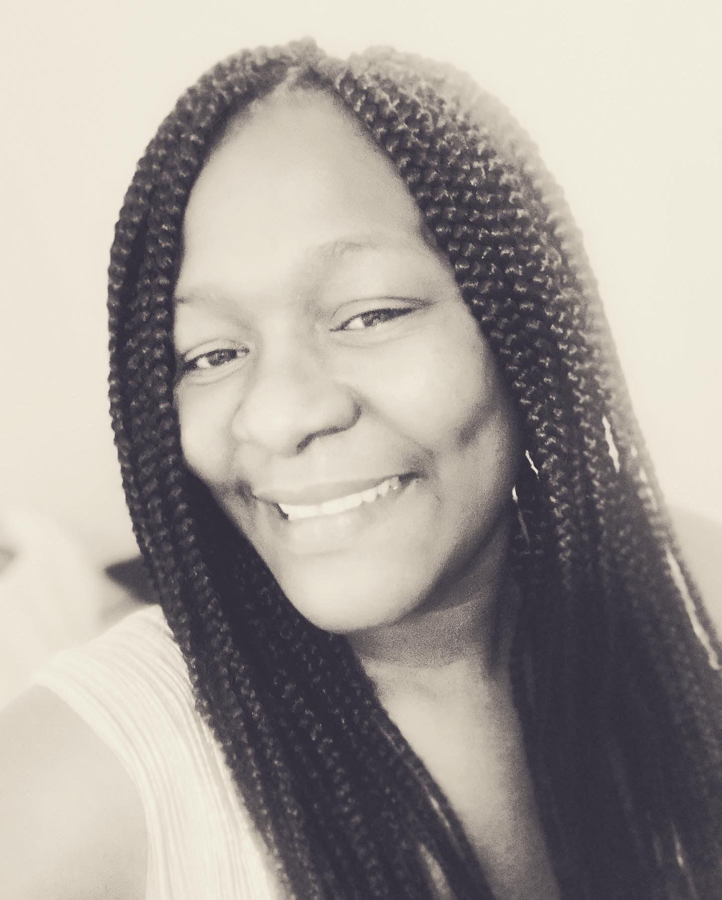 grayscale photography of woman with braided hair